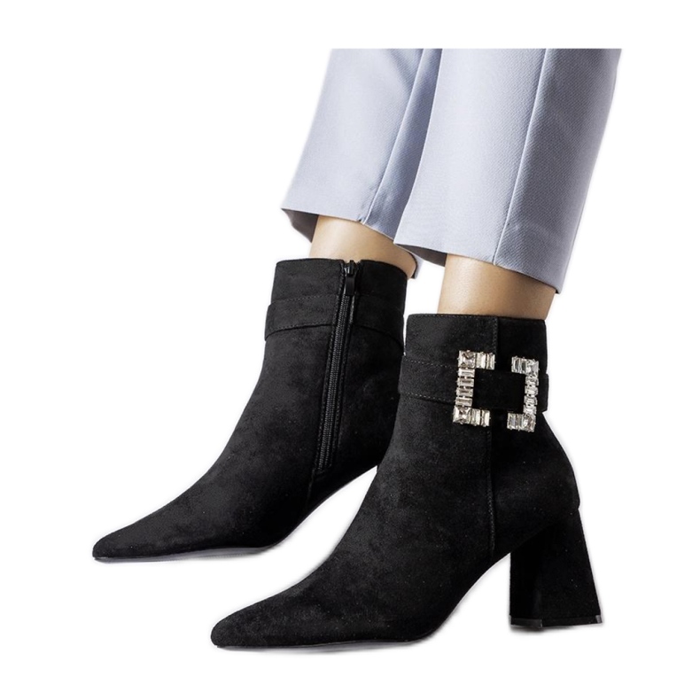 Black boots on a post with zircons