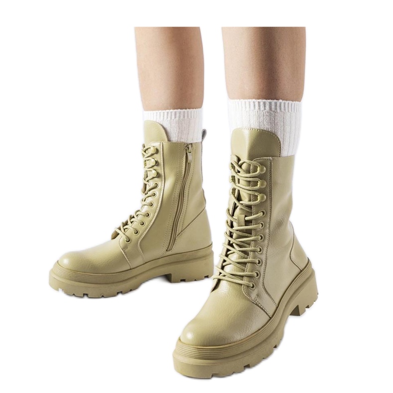 Light green flat boots with a protector