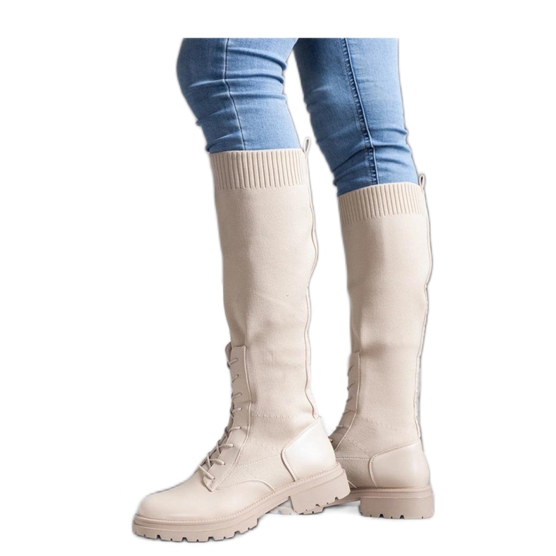 Beige slip-on boots with a flexible fabric upper