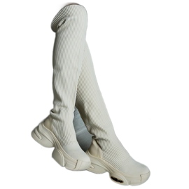 Beige slip-on boots with a flexible upper and a massive sole