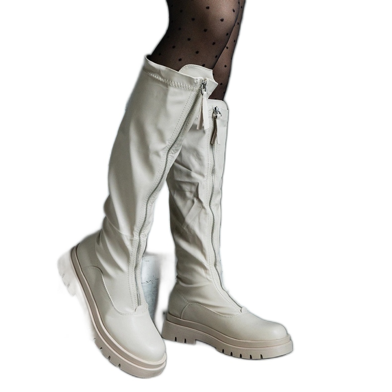 Beige eco-leather boots with a flat heel decorated with a zipper