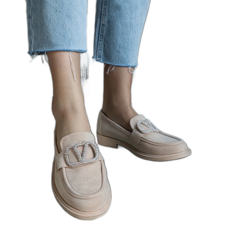 Beige moccasins decorated with rhinestones