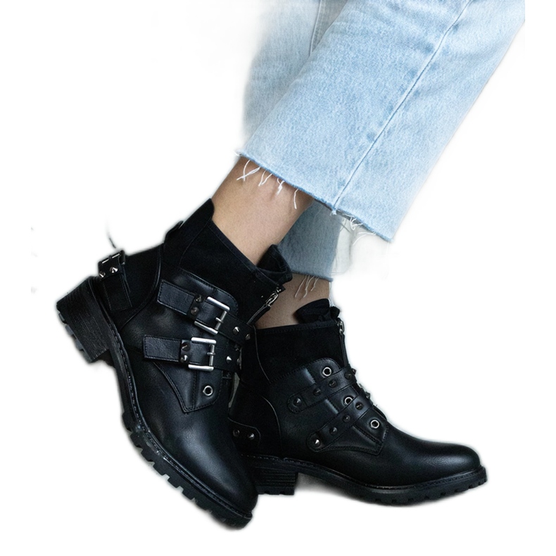 Black ankle boots decorated with studs with a flat heel