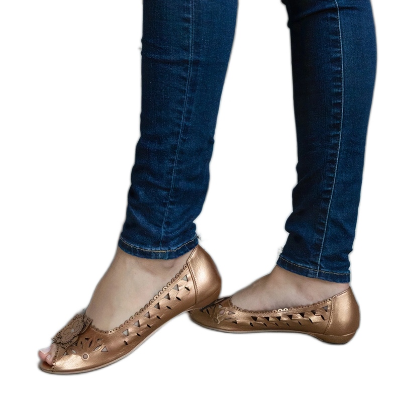 Gold openwork ballet flats with an open toe golden