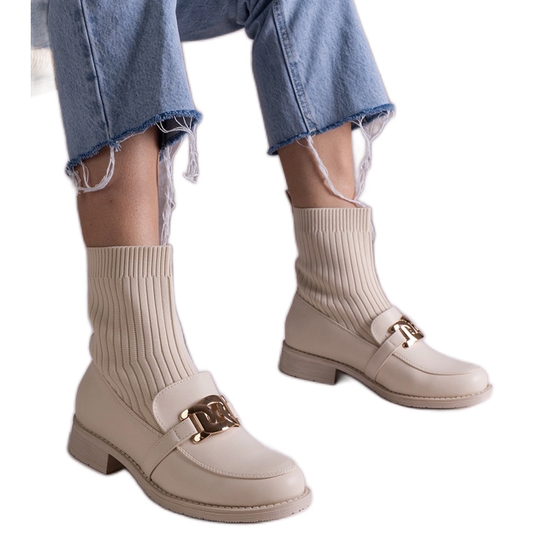Beige ankle boots with a fabric upper