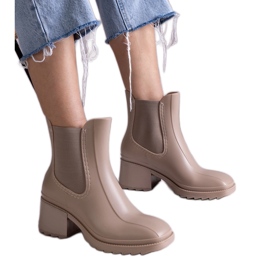 Beige Wellington boots on a high heel