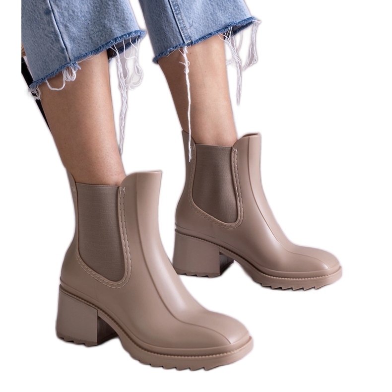 Beige Wellington boots on a high heel