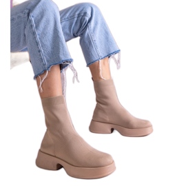 Beige ankle boots with a flexible upper