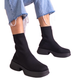 Black boots with a flexible upper Black boots with a flexible upper