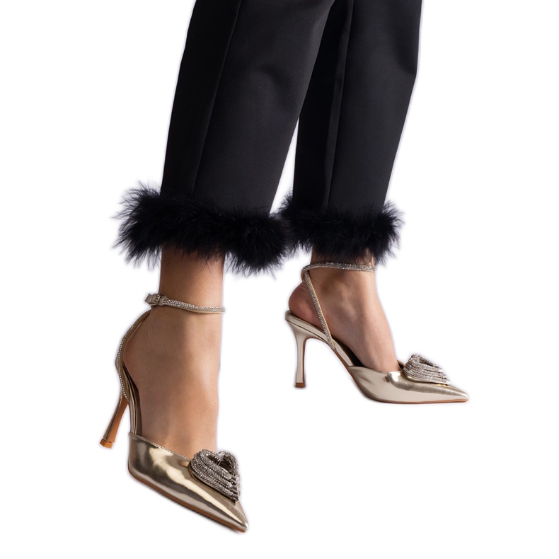 Gold high heels with an open heel decorated with zircons golden