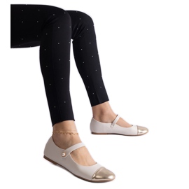 Beige and gold ballet flats with a patent toe, fastened with Velcro