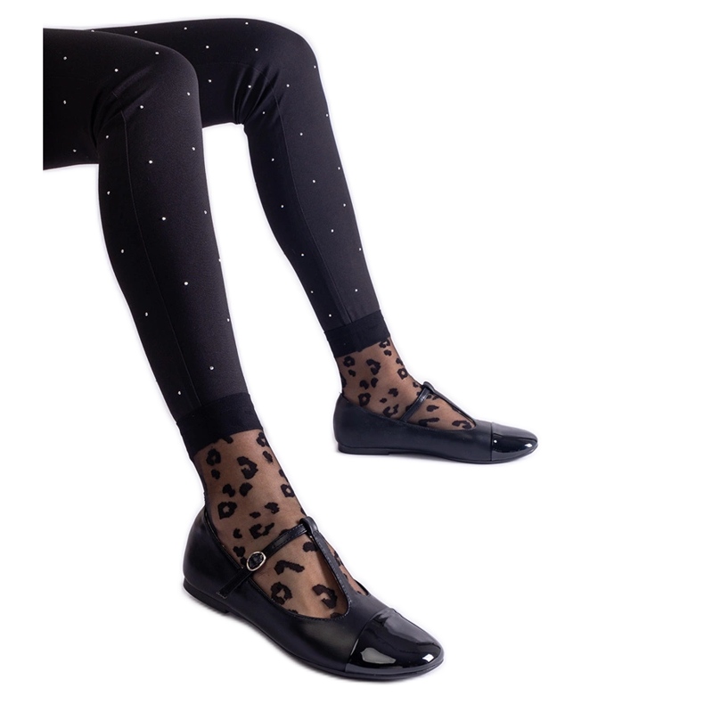 Black ballet flats with a patent toe and fastened with a buckle