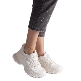 Beige sports sneakers on a massive sole