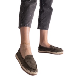 Green sliding espadrilles on the platform