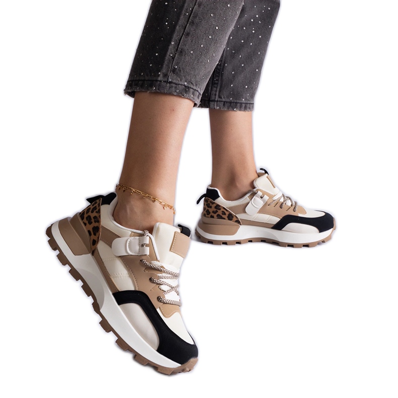 Beige sneakers decorated with an animal motif