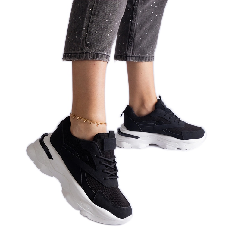 Black sneakers with a thick sole Black sneakers with a thick sole