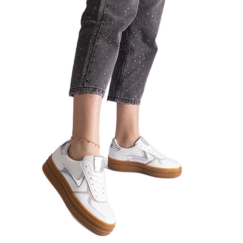 White and silver sneakers with a rubber sole