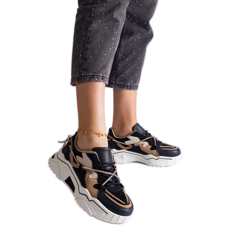 Black sneakers decorated with a zircon string