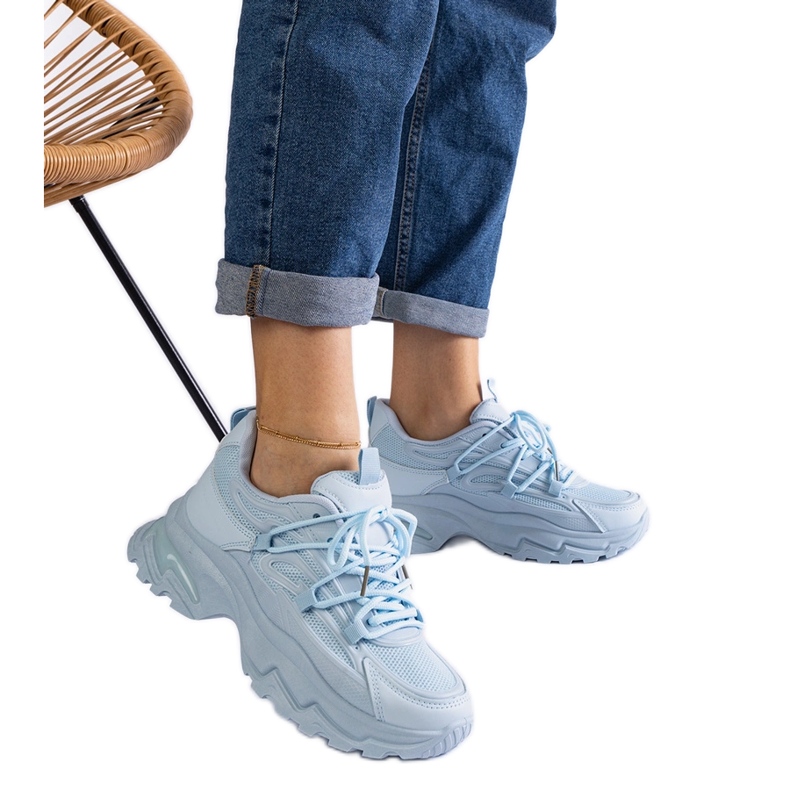 Blue sports sneakers with a massive sole