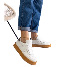 White lace-up sneakers with a platform