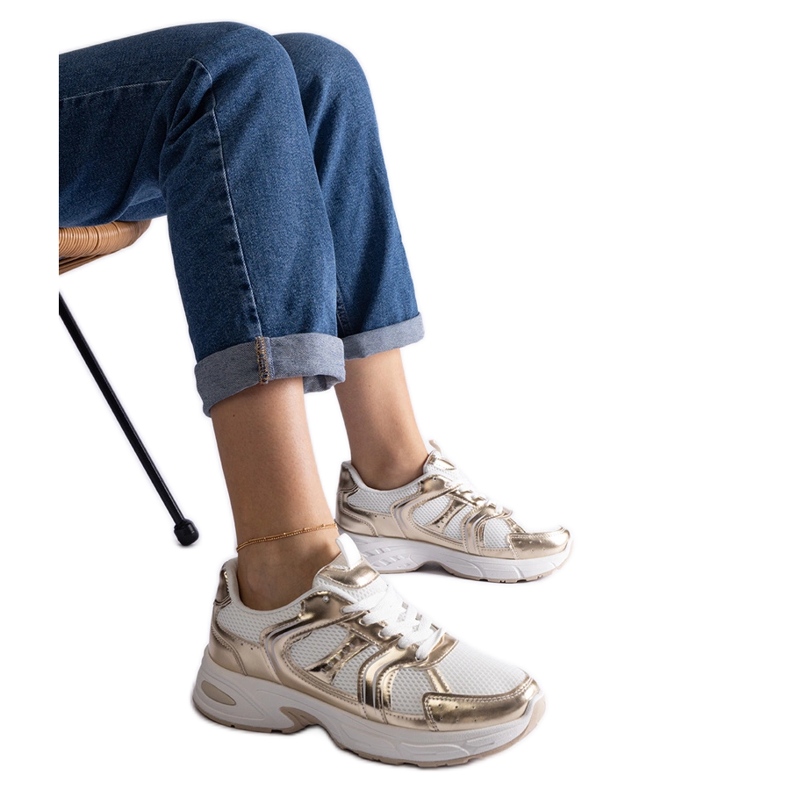 White and gold sports sneakers golden