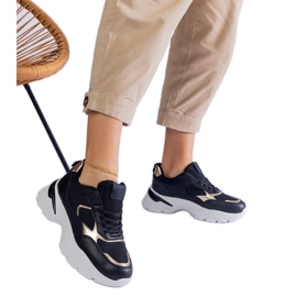 Black sneakers on a massive sole