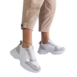 White sneakers on a massive sole White sneakers on a massive sole