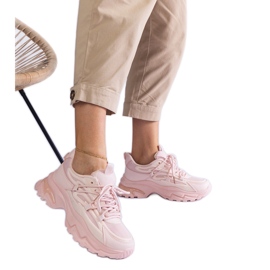 Pink sports sneakers with a massive sole
