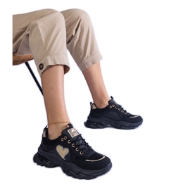 Black sneakers on a black heart platform Black sneakers on a black heart platform