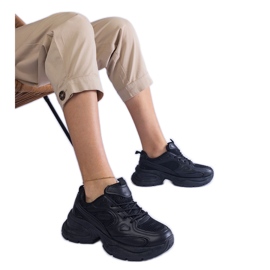 Black sneakers on a massive sole
