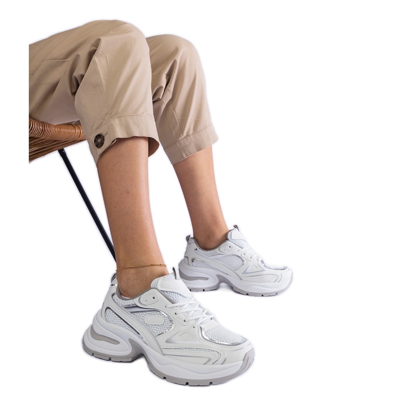 White sneakers on a massive sole White sneakers on a massive sole