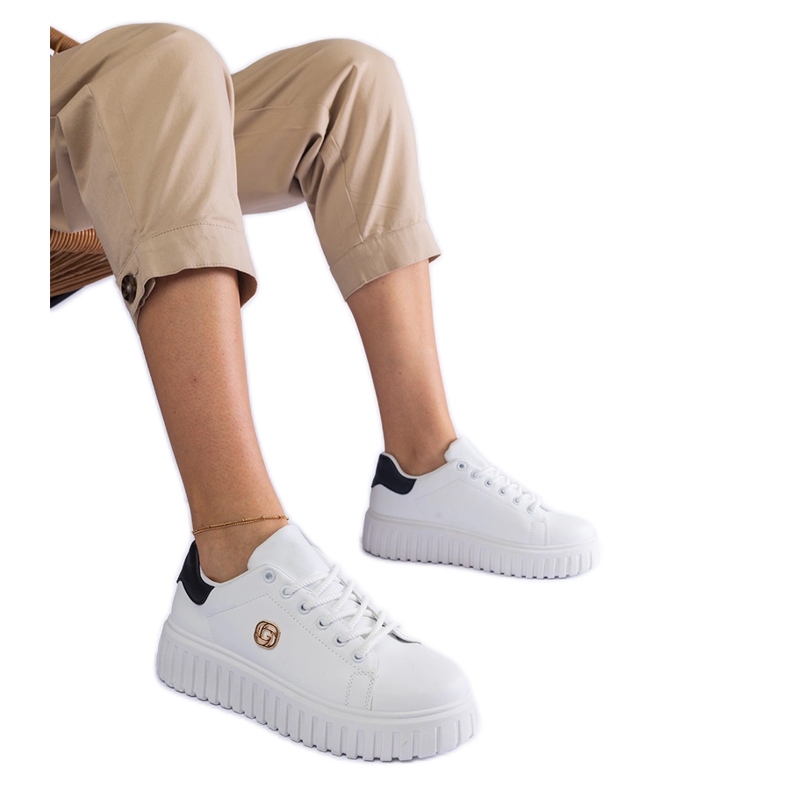 White and white sneakers on a thick sole