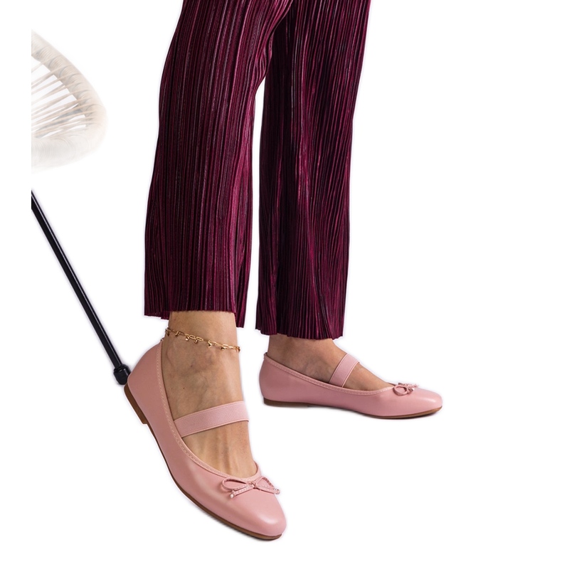 Pink ballerinas with an elastic band and a decorative bow