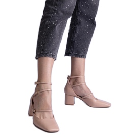 Beige high-heeled pumps with buckles