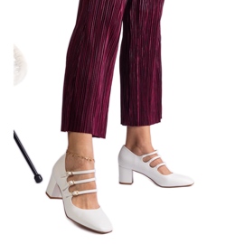 White high-heeled pumps with decorative buckles