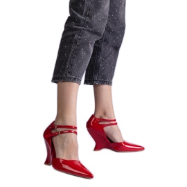 Red pumps varnished on wedge with buckles Red pumps varnished on wedge with buckles