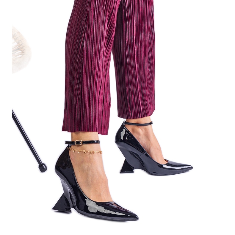 Black patent leather wedge pumps
