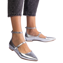 Silver flat heels with metallic buckles