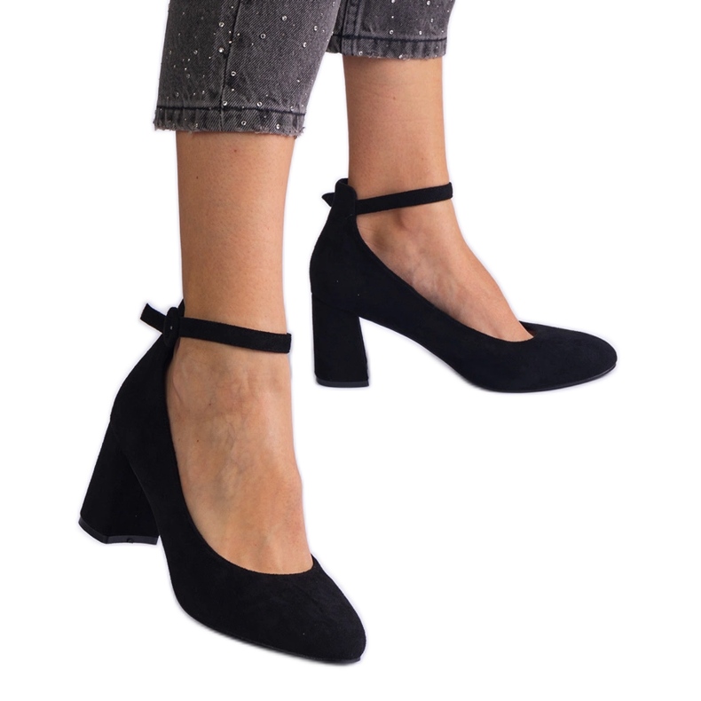 Black pumps on the eco-leather pillar