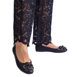 Black ballerinas decorated with a flower