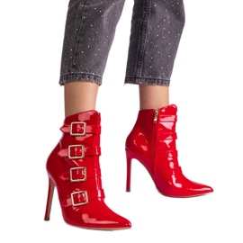 Red boots varnished on a high heel Red boots varnished on a high heel
