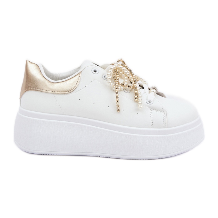 Women's sneakers on the platform with white and gold decorations