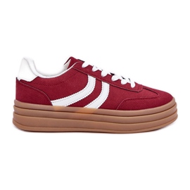 Stylish sneakers on the burgundy platform red Stylish sneakers on the burgundy platform red