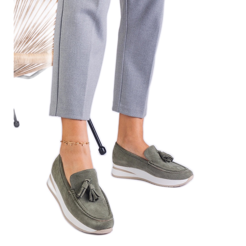 Green women's loafers on the platform with fringes Green women's loafers on the platform with fringes