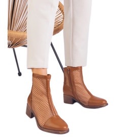Brown mesh boots on the post Brown mesh boots on the post