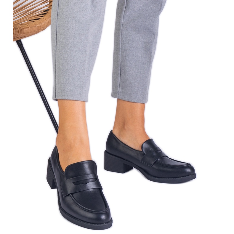 Black eco -leather pumps on a low post Black eco -leather pumps on a low post