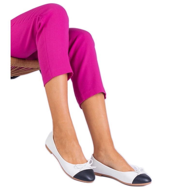 White ballerinas with a bow and a black nose