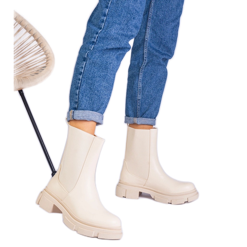 Beige ankle boots with a flexible insertion