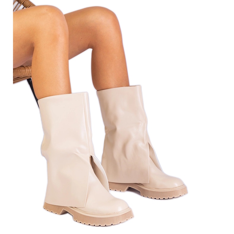Beige boots with a folded upper