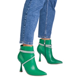 Green boots on a high heel decorated with zircons